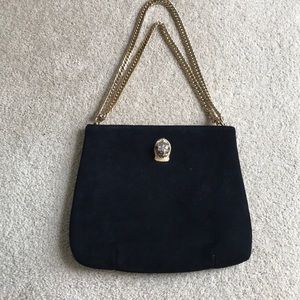 Black shoulder bag with gold hardware